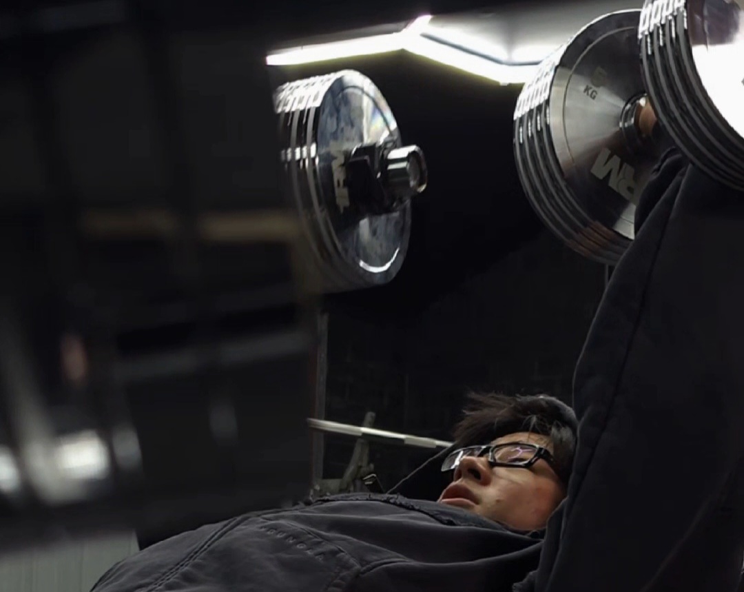 A lifter pushing through a final rep near failure