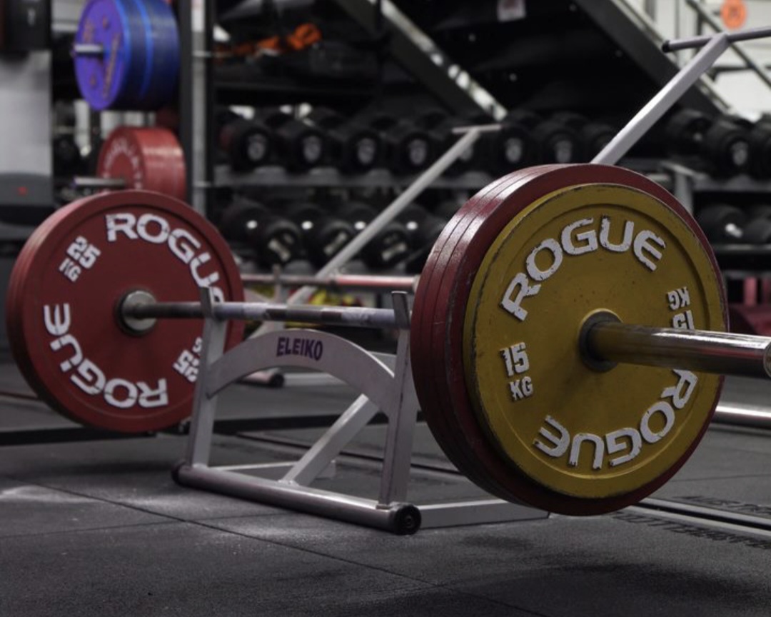 A loaded barbell ready for a working set